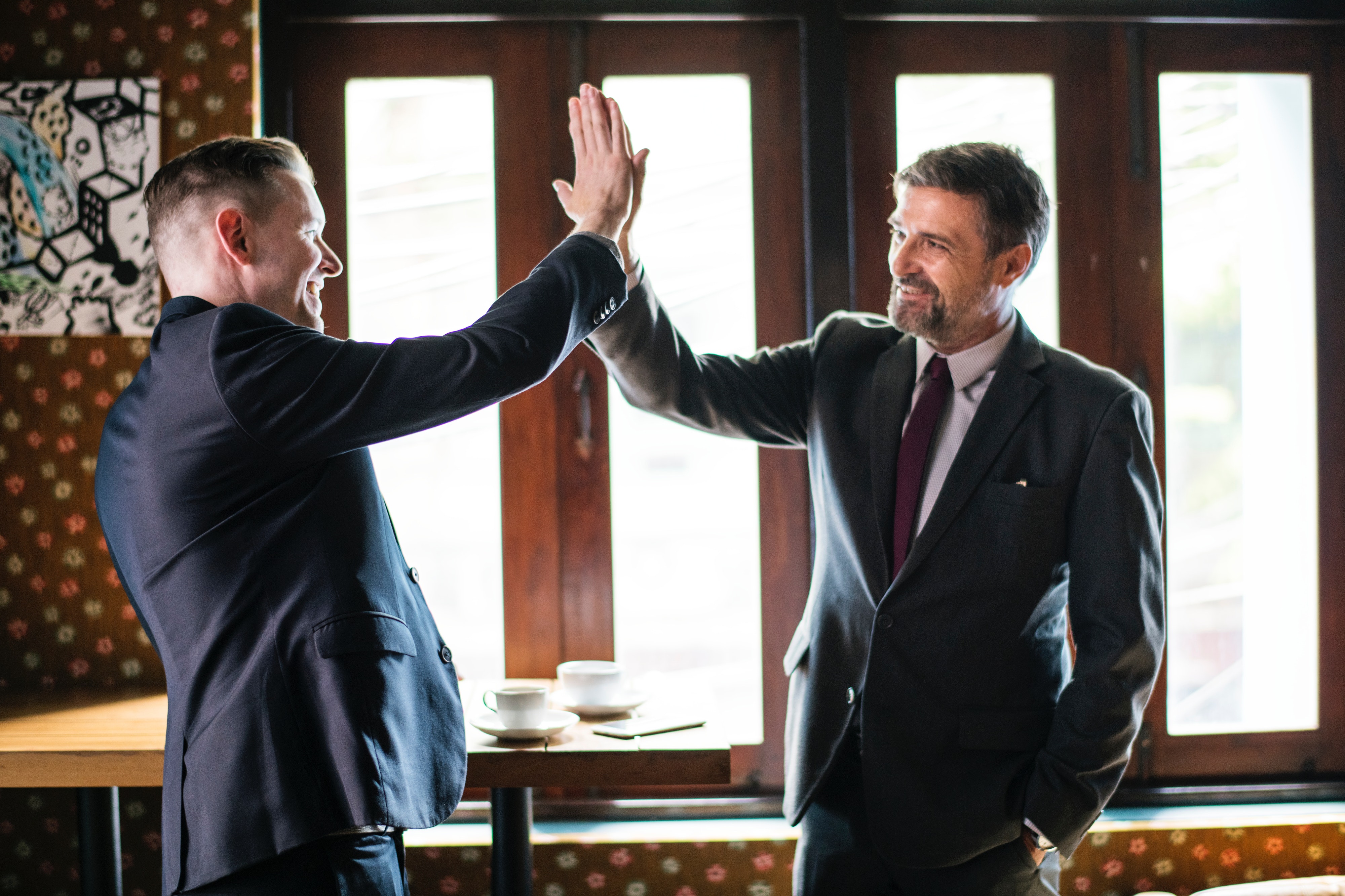 high five-business men-aumentoo blog